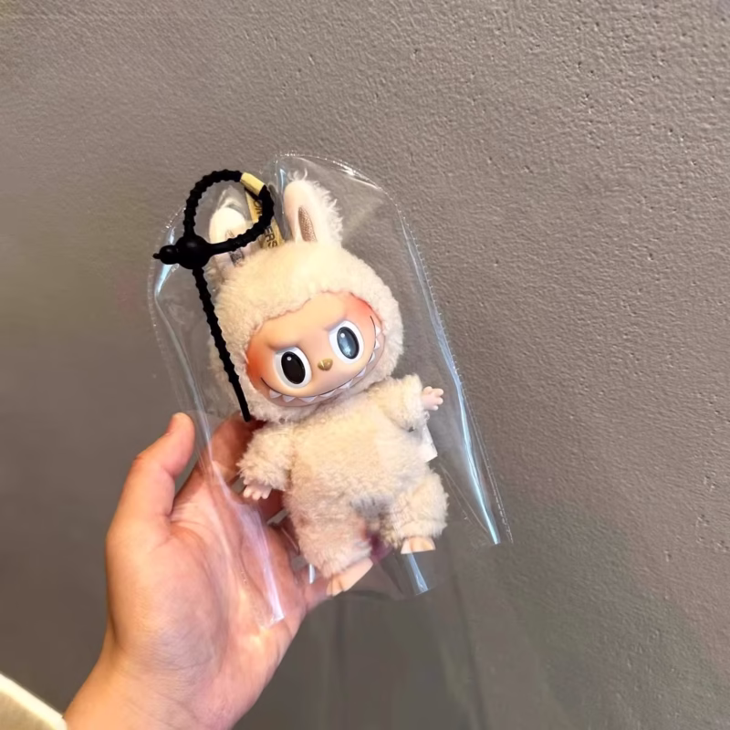 With the signature Labubu style, the Fashion Rainproof PVC Transparent Doll Carrying Bag will protect and give style to your 17cm miniature figures. - Image 2